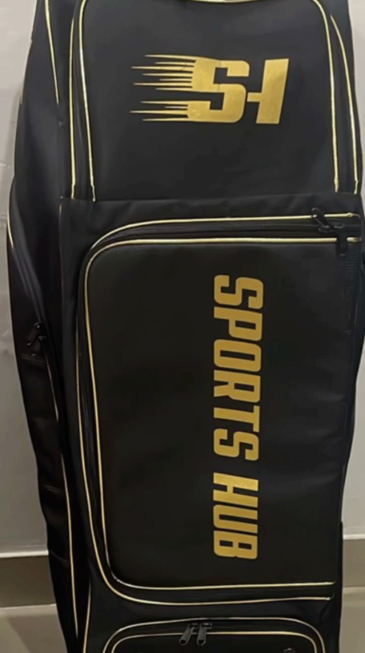 Front view of the black Sports Hub Pro Edition cricket kit bag highlighting the premium gold branding and integrated number lock security system.